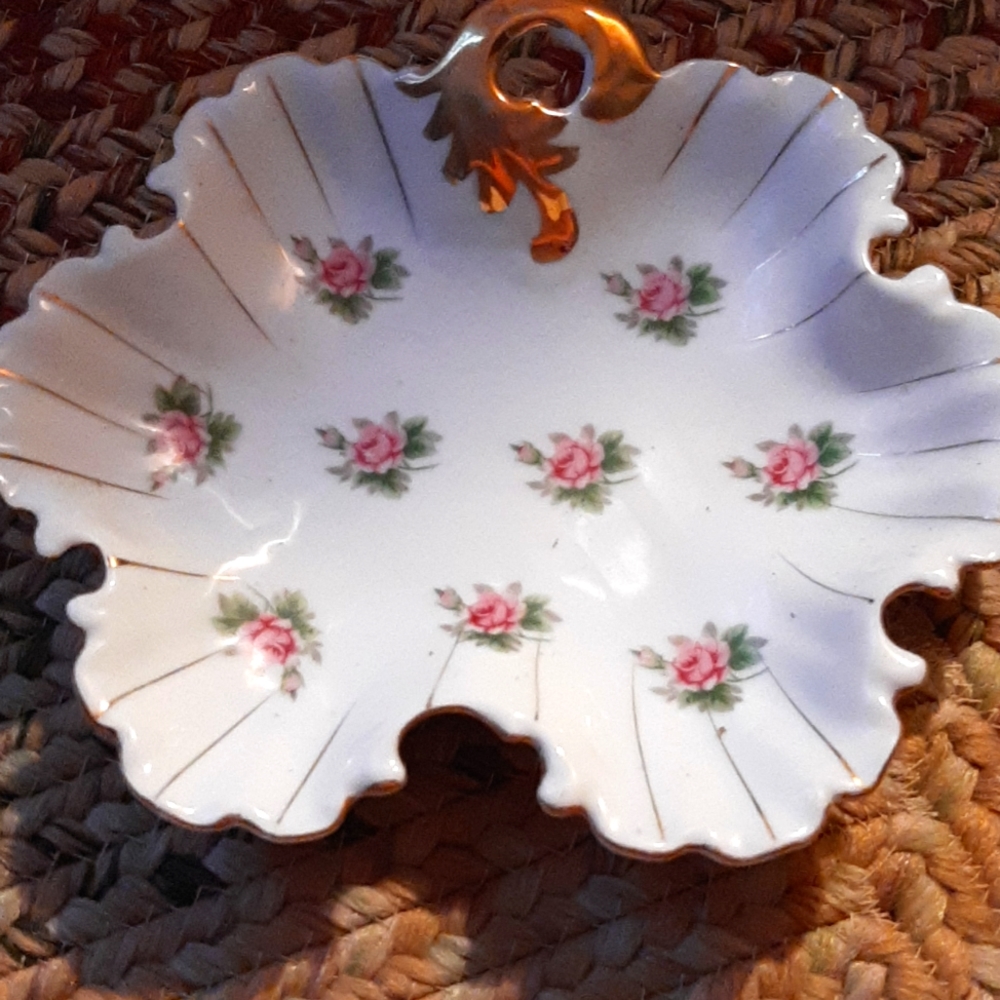 Porcelain candy dish. White with gold accents.